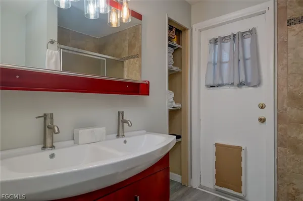 a bathroom with a sink and a mirror