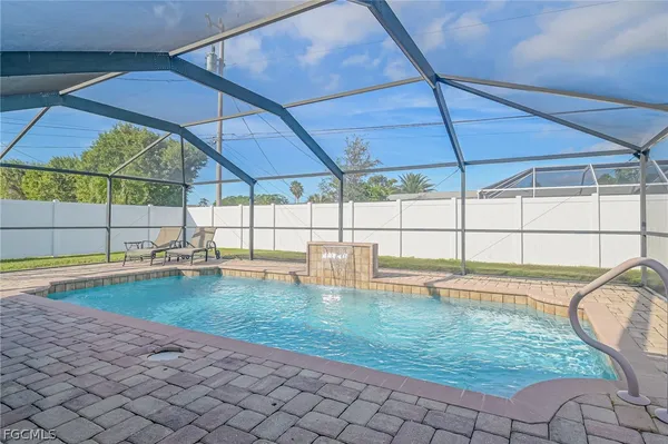 a swimming pool with an outdoor seating