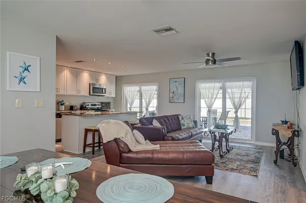 a living room with furniture and a window
