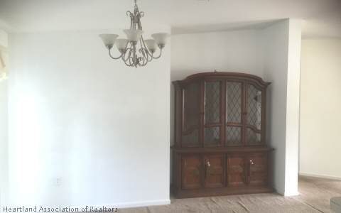 4328 Skipper Road Sebring, FL 33875 - Photo 5 of 8 a view of a hallway with wooden door