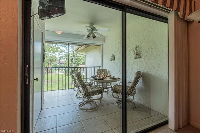 a kitchen with granite countertop white cabinets and appliances