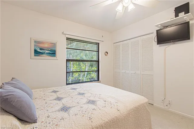 a bathroom with a sink mirror and a shower