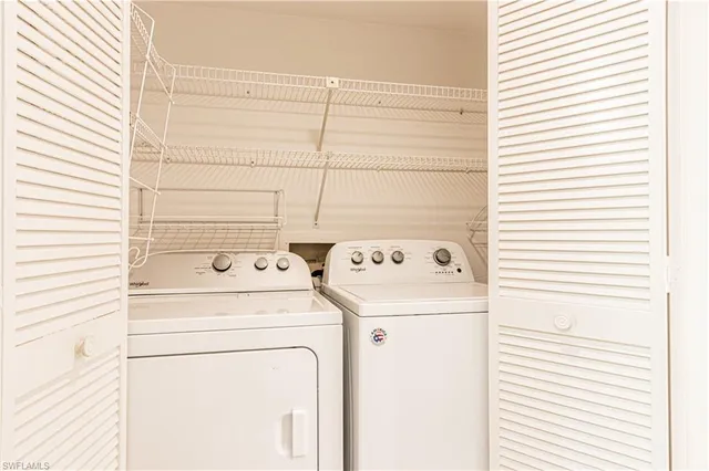 a room with furniture and a large window