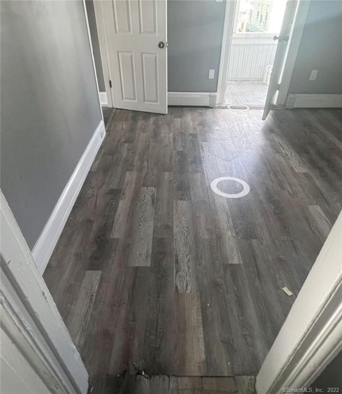 a view of wooden floor in an empty room