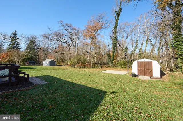 a view of a house with backyard porch and sitting area