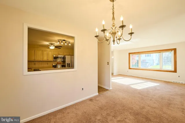 a view of a hallway with a chandelier