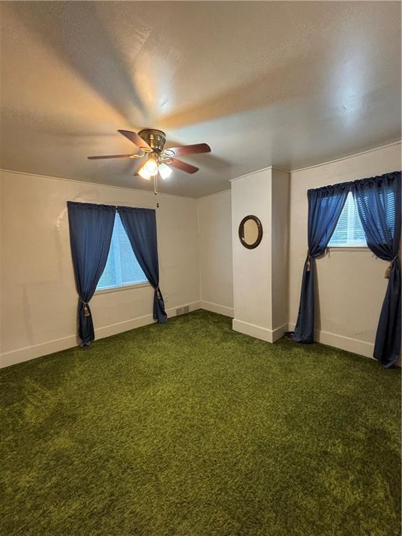 603 7th Avenue Coraopolis, PA 15108 - Photo 12 of 13 an empty room with windows and fan