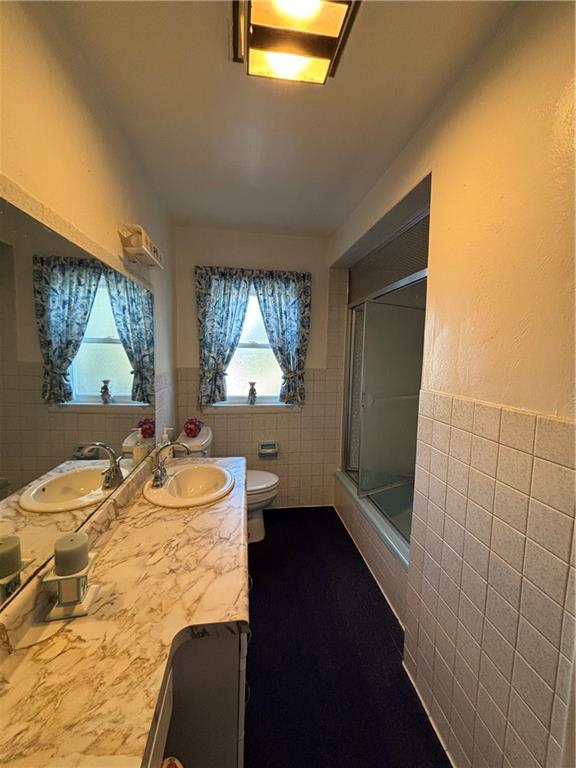 603 7th Avenue Coraopolis, PA 15108 - Photo 13 of 13 a bathroom with a sink and a mirror