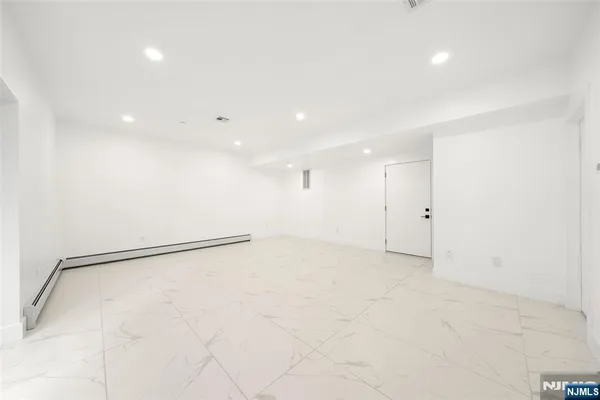 a view of livingroom with washer and dryer