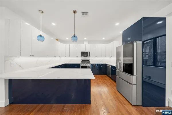 a kitchen with a sink stove and microwave