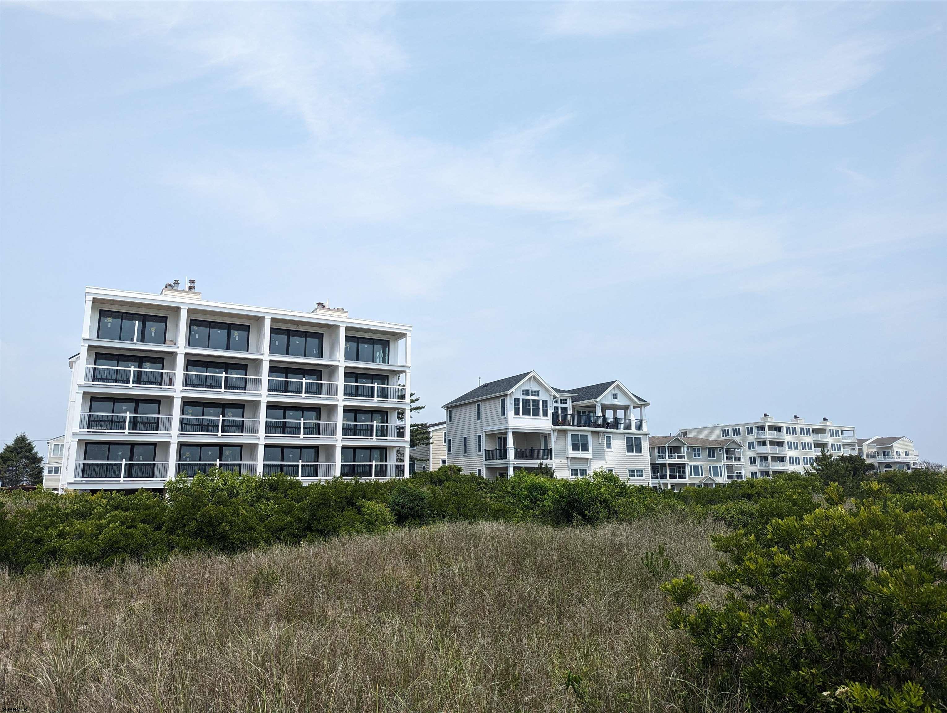 321 6th Street South, Unit 1 Brigantine, NJ 08203 - Photo 12 of 16 a view of front a house and a yard
