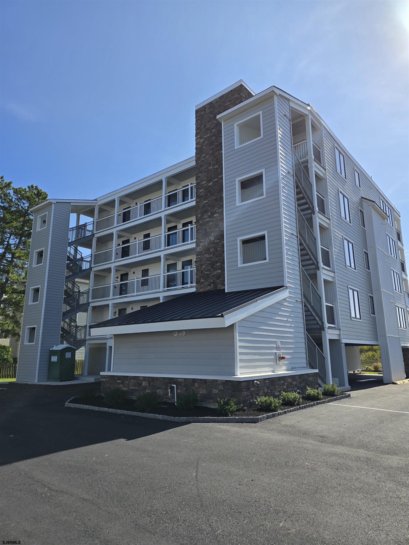 321 6th Street South, Unit 1 Brigantine, NJ 08203 - Photo 4 of 16 a front view of a building