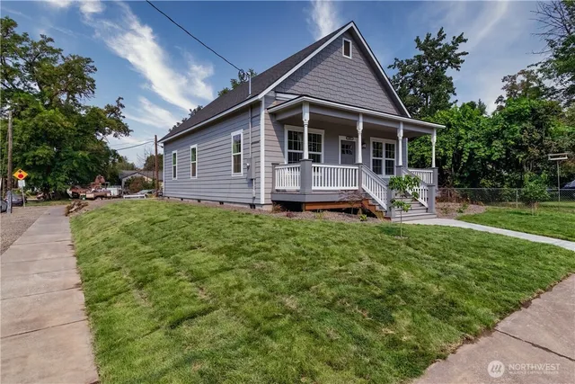 a front view of house with a garden and patio
