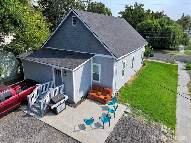 a aerial view of a house with backyard