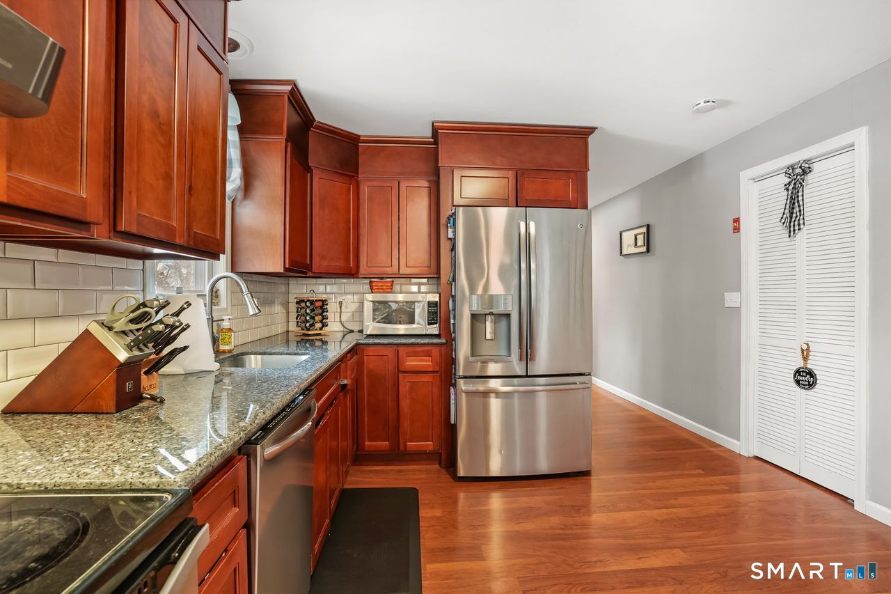 17 Forest View Drive Wolcott, CT 06716 - Photo 15 of 33 a kitchen with stainless steel appliances granite countertop a refrigerator and a sink