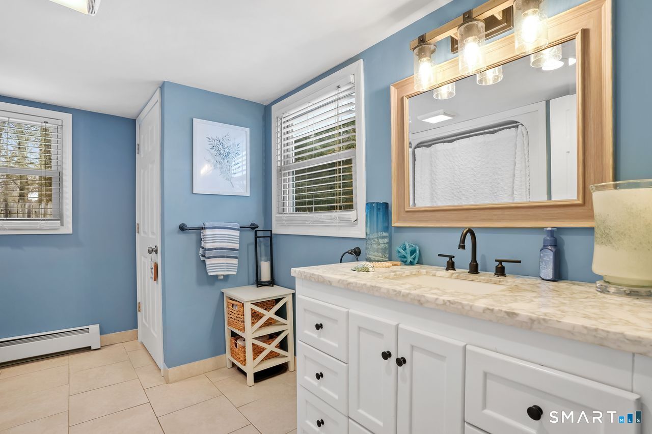 17 Forest View Drive Wolcott, CT 06716 - Photo 17 of 33 a bathroom with a sink and a mirror