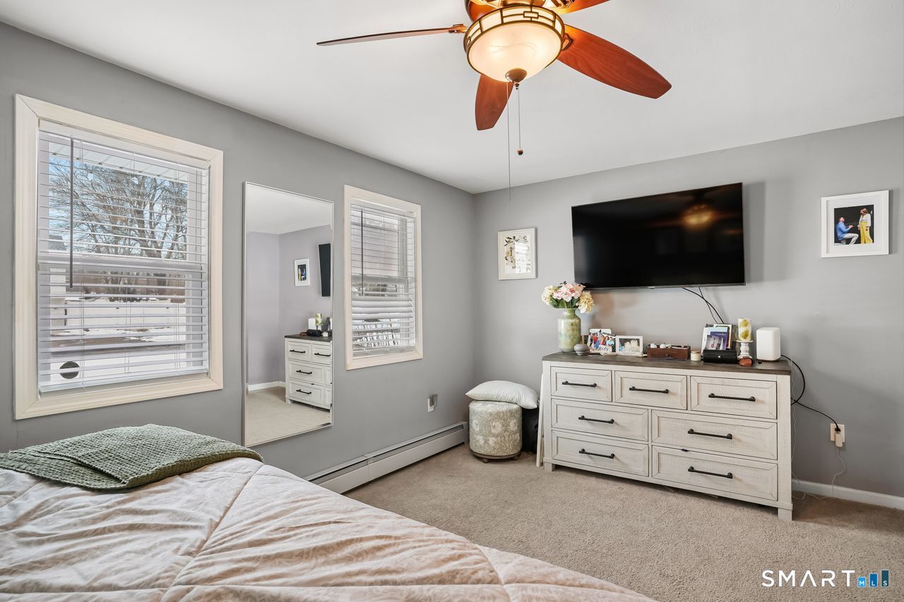 17 Forest View Drive Wolcott, CT 06716 - Photo 21 of 33 a bedroom with a bed and flat screen tv