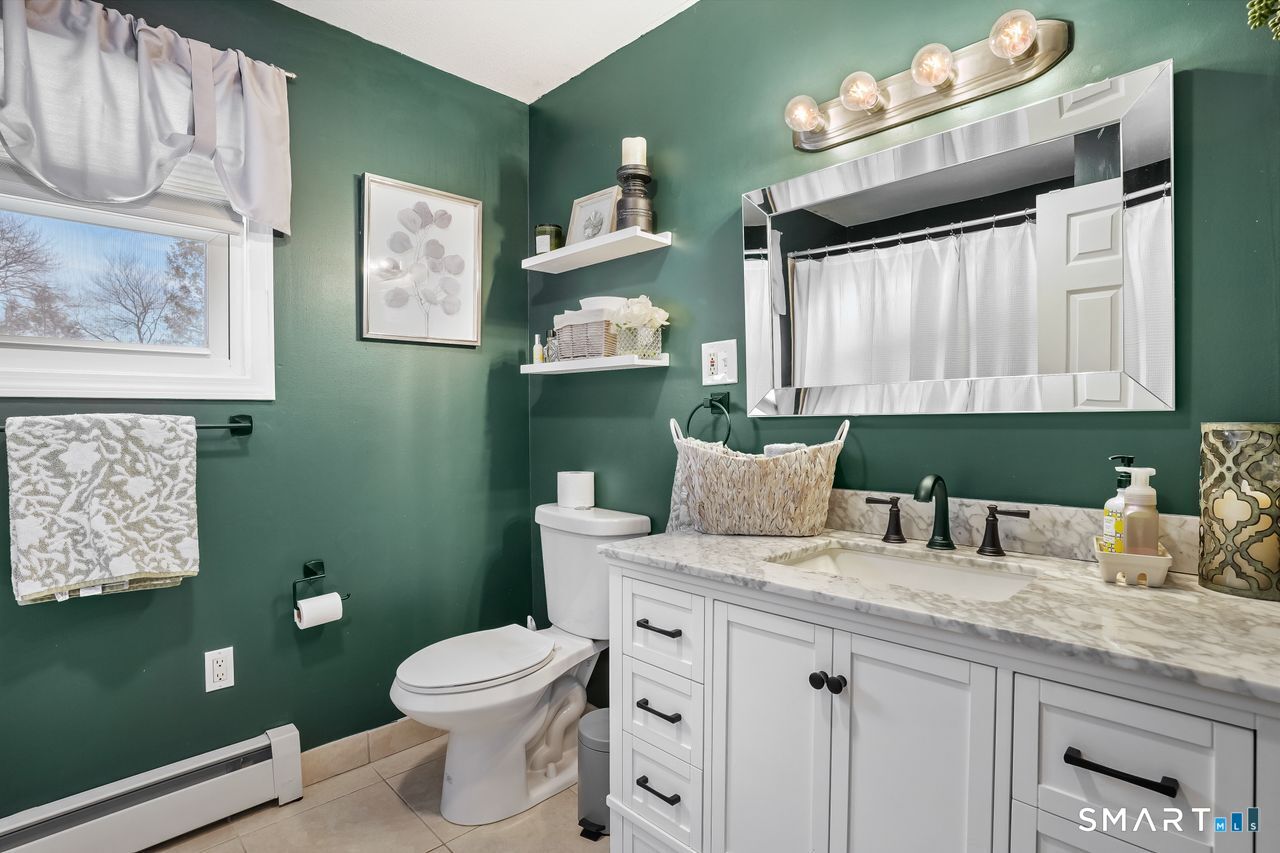17 Forest View Drive Wolcott, CT 06716 - Photo 29 of 33 a bathroom with a granite countertop toilet sink and mirror