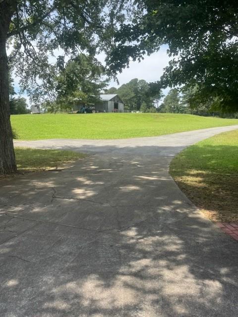 865 Morgan Valley Road Rockmart, GA 30153 - Photo 27 of 30 a view of a field with an trees in the background