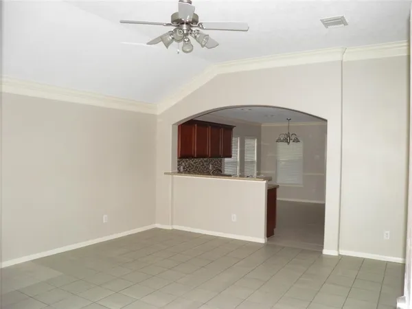 a view of a livingroom with a furniture and a ceiling fan