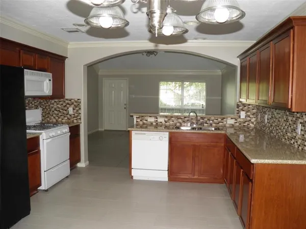 a bathroom with a sink a vanity and a large mirror