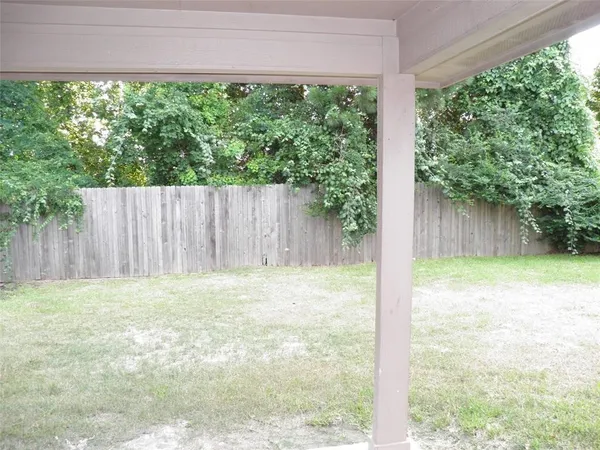 a view of backyard with green space