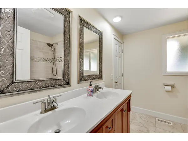 a bathroom with a sink vanity and a mirror