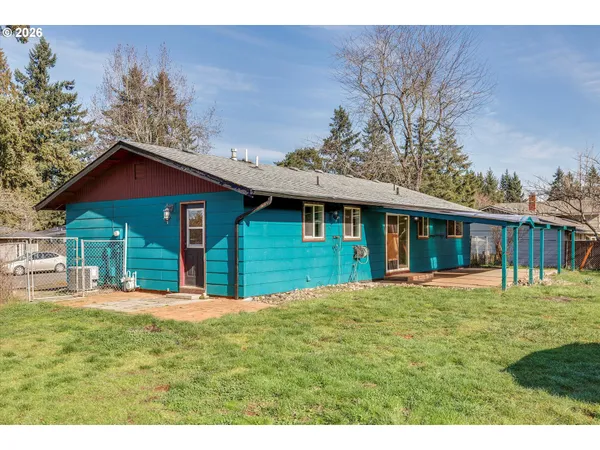 a house that has a big yard in front of it