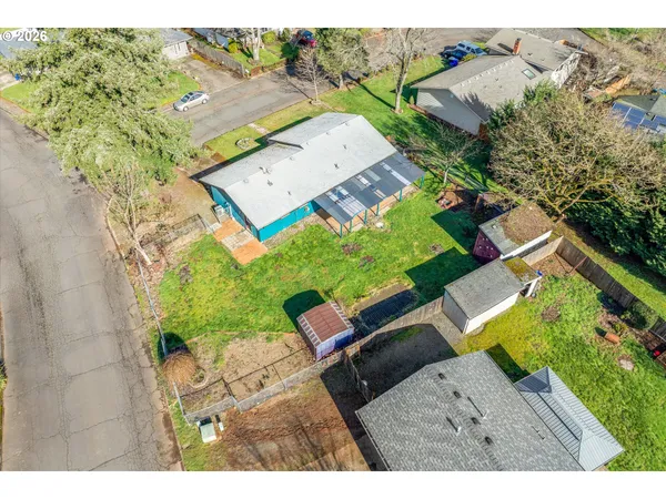 an aerial view of a house with a garden