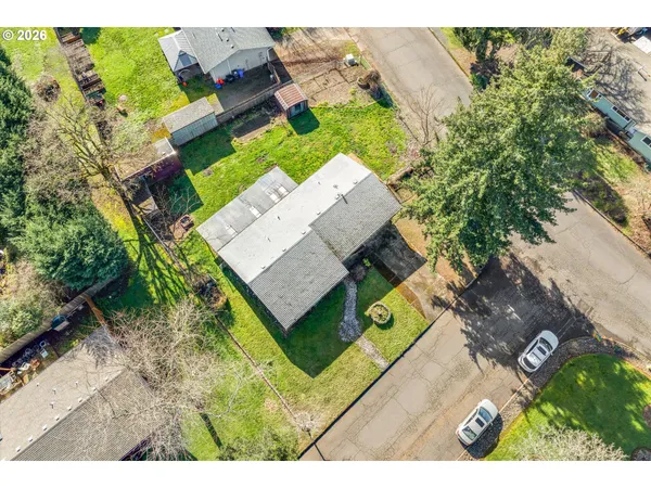 an aerial view of a house with a garden