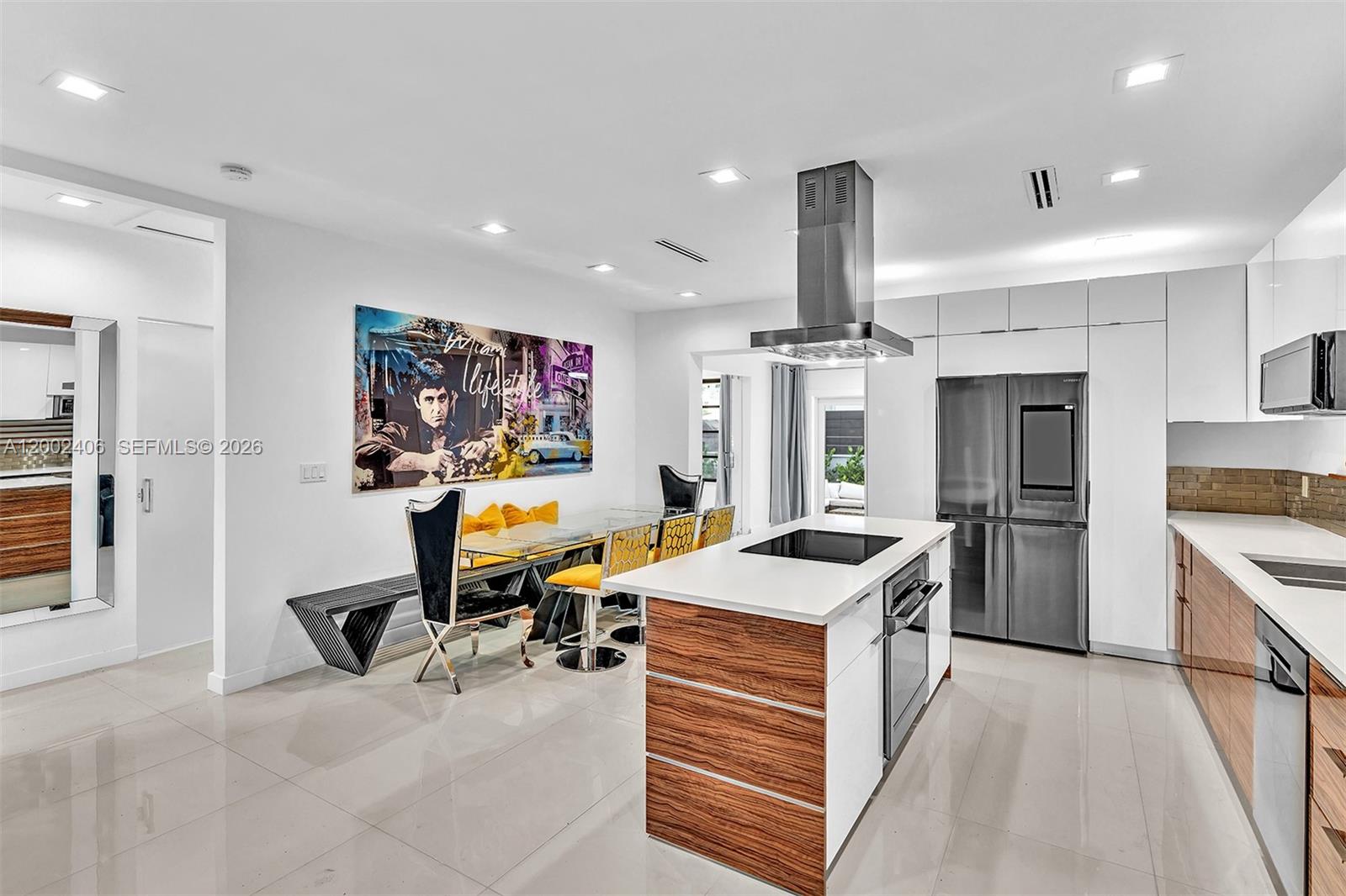 1002 10th Street, Unit 1002 Miami Beach, FL 33139 - Photo 11 of 71 a room with stainless steel appliances kitchen island granite countertop a sink and cabinets