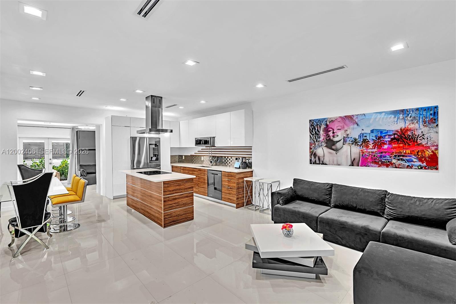 1002 10th Street, Unit 1002 Miami Beach, FL 33139 - Photo 24 of 71 a living room with furniture kitchen view and a couch