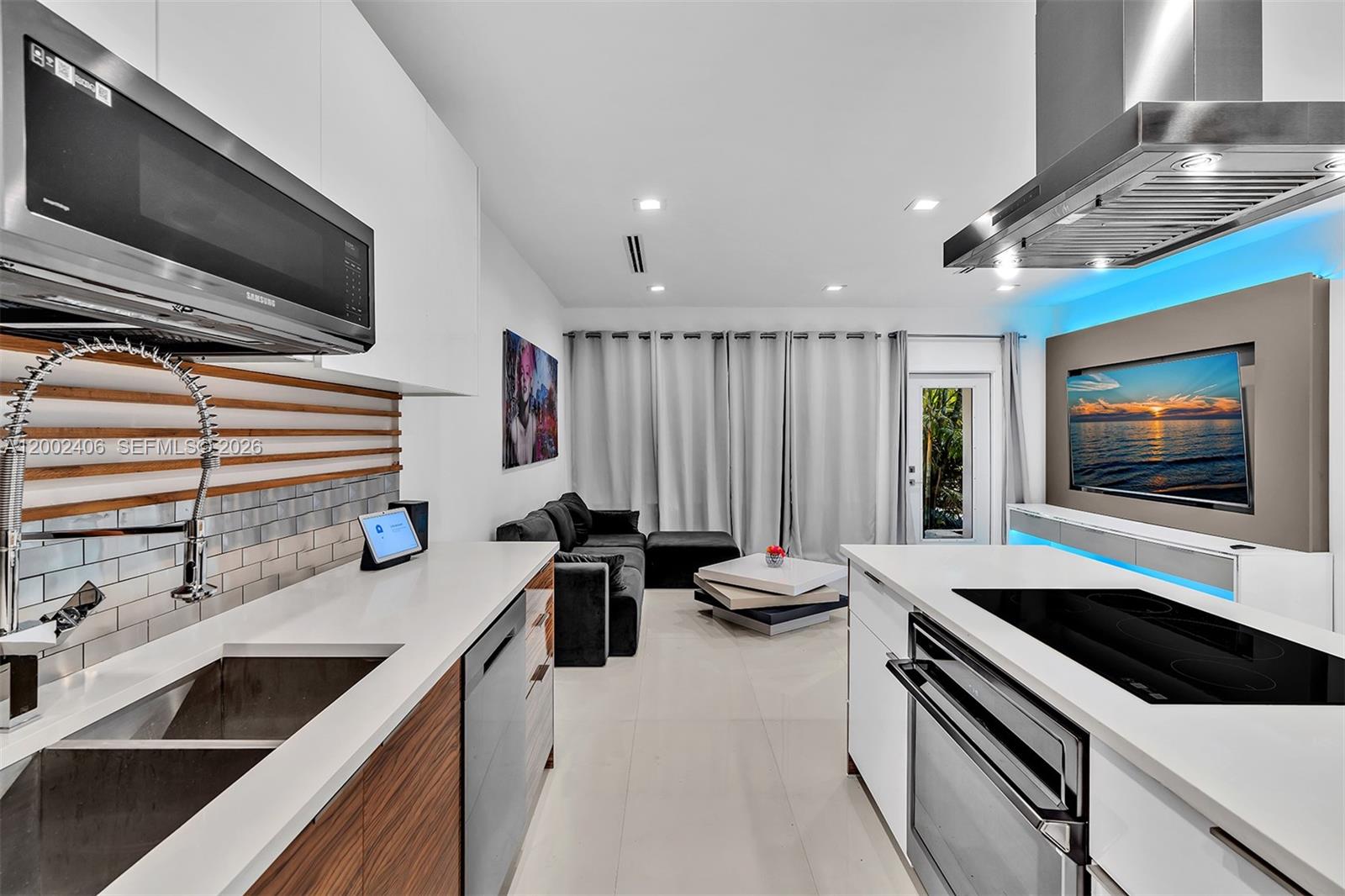 1002 10th Street, Unit 1002 Miami Beach, FL 33139 - Photo 29 of 71 a kitchen with a stove and a microwave