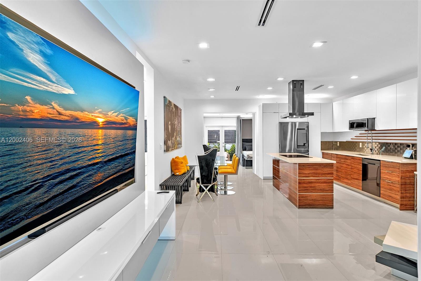 1002 10th Street, Unit 1002 Miami Beach, FL 33139 - Photo 3 of 71 a living room with stainless steel appliances furniture and a kitchen view