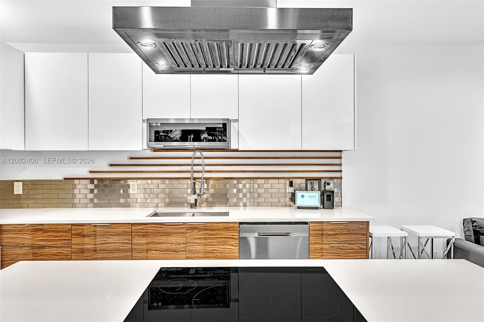 1002 10th Street, Unit 1002 Miami Beach, FL 33139 - Photo 34 of 71 a view of kitchen with granite countertop stainless steel appliances and sink