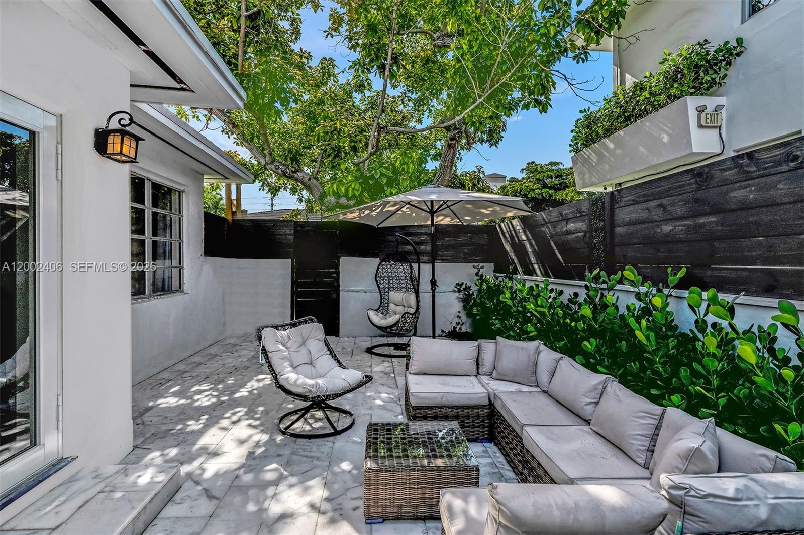 1002 10th Street, Unit 1002 Miami Beach, FL 33139 - Photo 38 of 71 a view of a patio with furniture and a potted plants