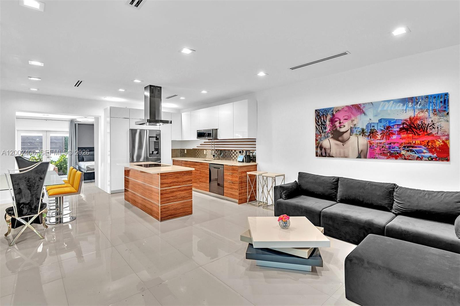 1002 10th Street, Unit 1002 Miami Beach, FL 33139 - Photo 4 of 71 a living room with furniture and kitchen view