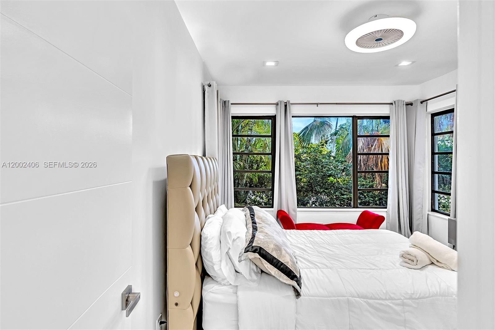 1002 10th Street, Unit 1002 Miami Beach, FL 33139 - Photo 53 of 71 a bedroom with a bed and wooden floor