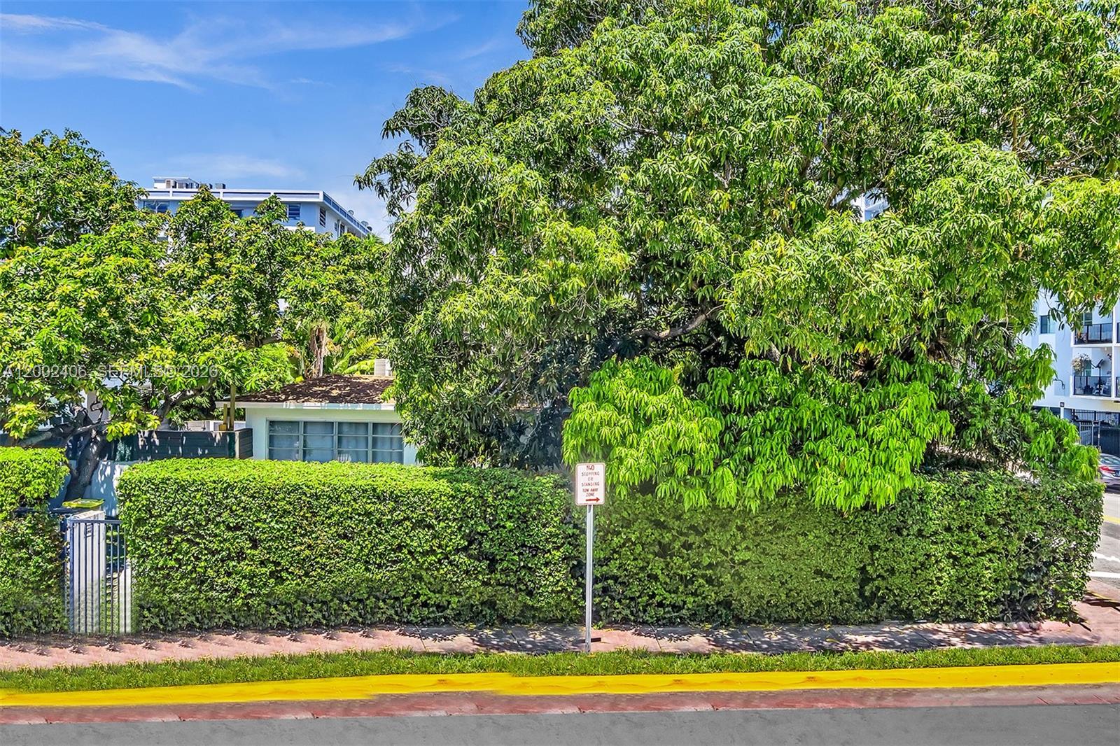 1002 10th Street, Unit 1002 Miami Beach, FL 33139 - Photo 69 of 71 a view of a swimming pool with an outdoor space and seating area