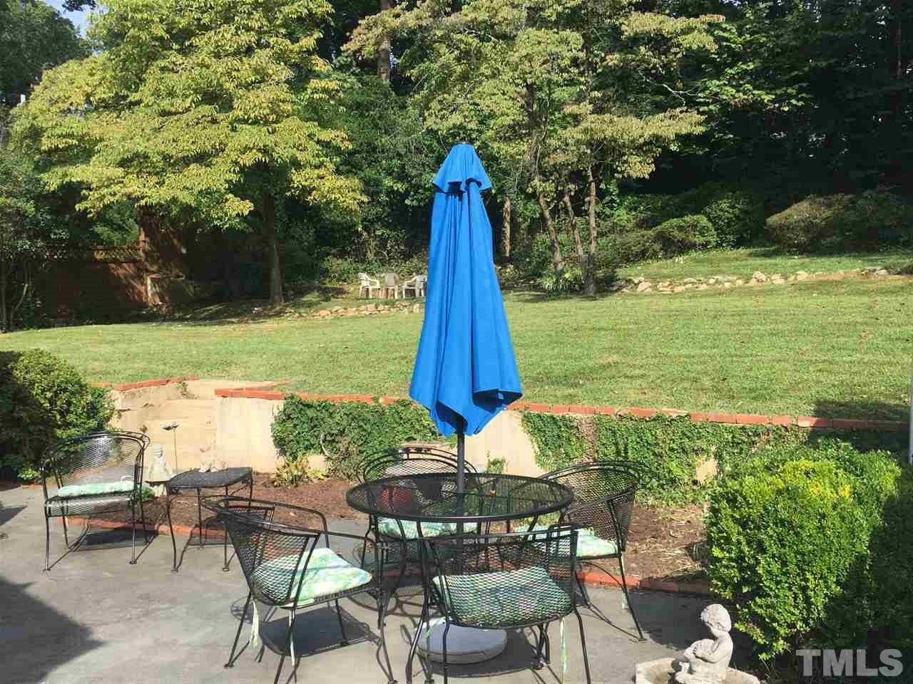 1418 Duplin Road Raleigh, NC 27607 - Photo 14 of 16 a view of a table and chairs in the garden