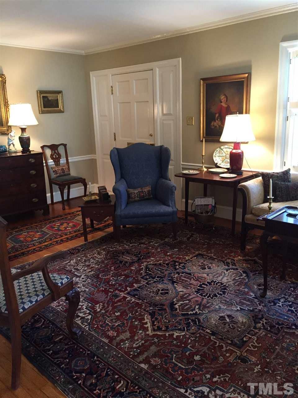 1418 Duplin Road Raleigh, NC 27607 - Photo 4 of 16 a living room with furniture and a lamp