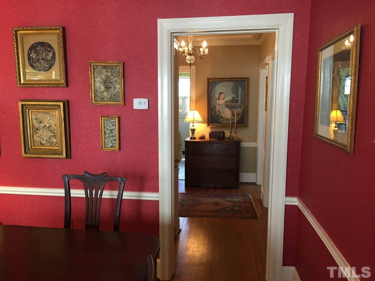1418 Duplin Road Raleigh, NC 27607 - Photo 6 of 16 a hallway with furniture and wooden floor