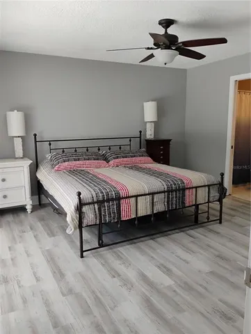 a bed room with a bed and a television