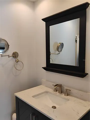 a park view with a bench and floor to ceiling window