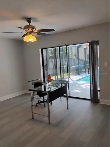 a view of garden with wooden fence