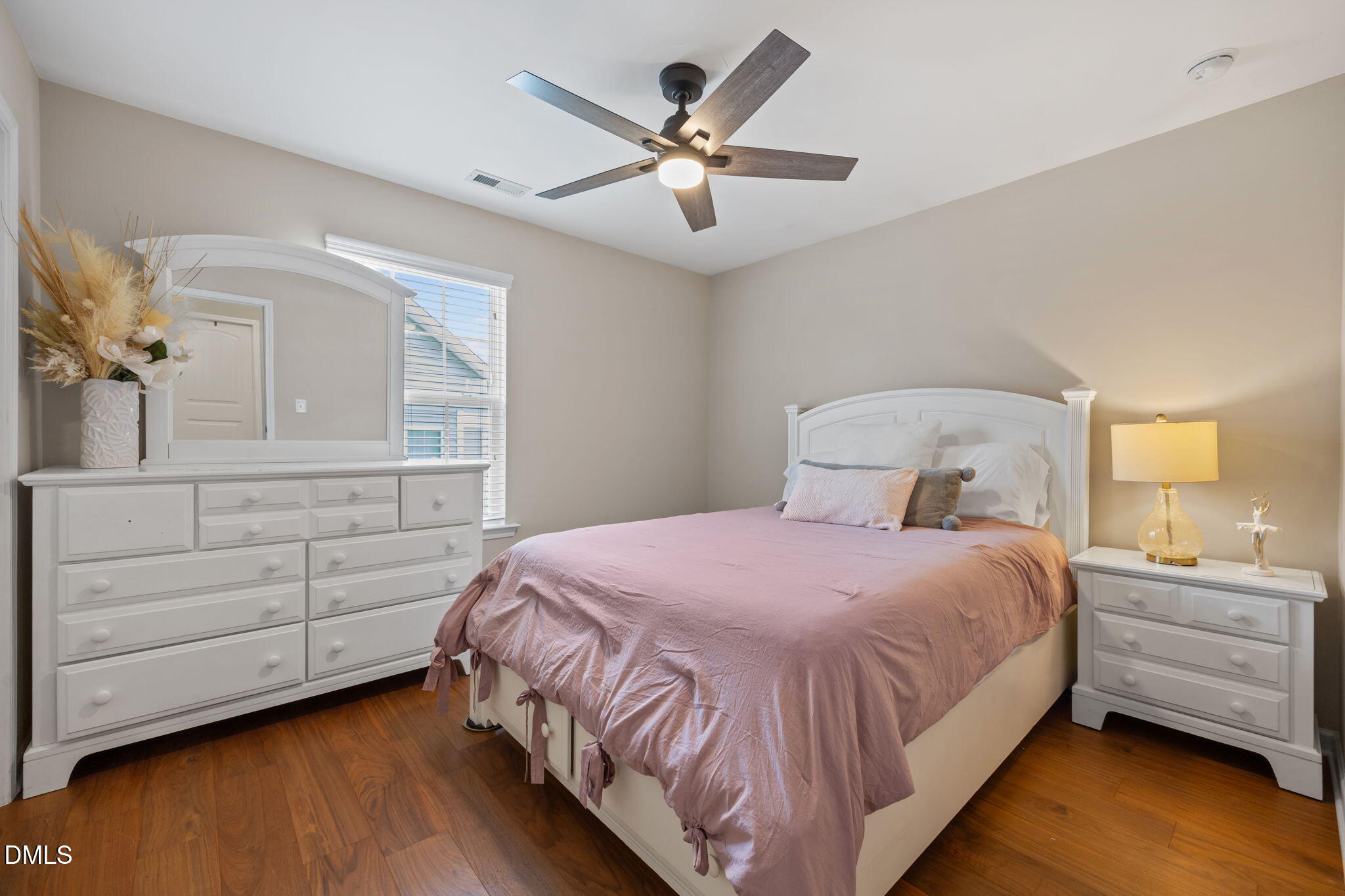 5049 Jelynn Street Raleigh, NC 27616 - Photo 18 of 33 a bedroom with a bed and a dresser