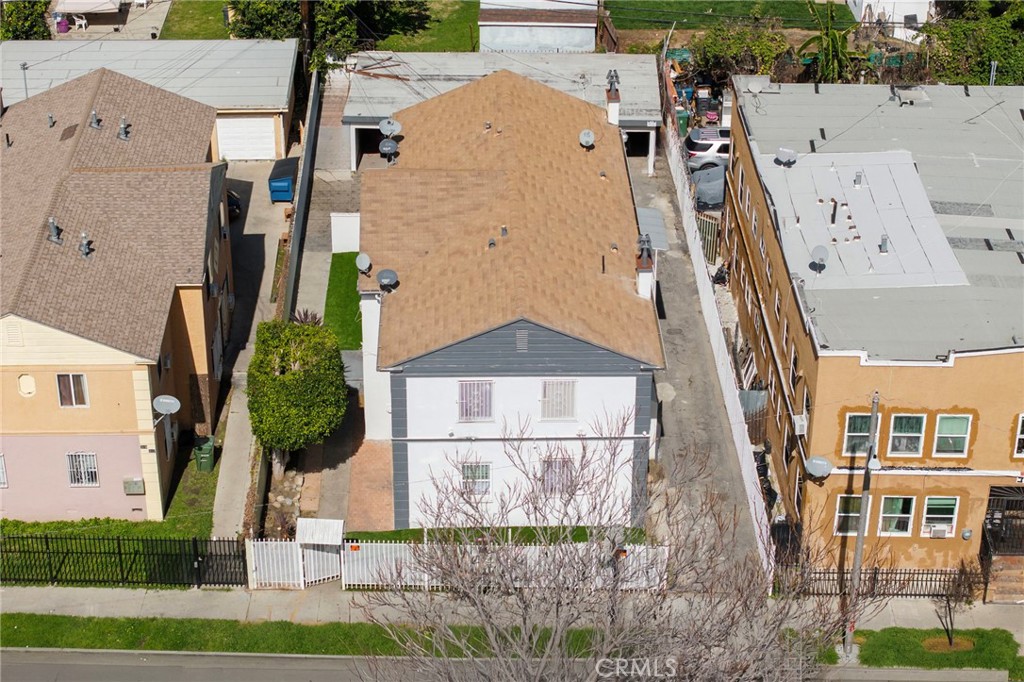 313 West Magnolia Street Compton, CA 90220 - Photo 11 of 11 an aerial view of a house with a yard and potted plants