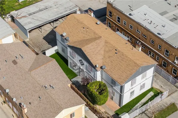 an aerial view of a house with a yard