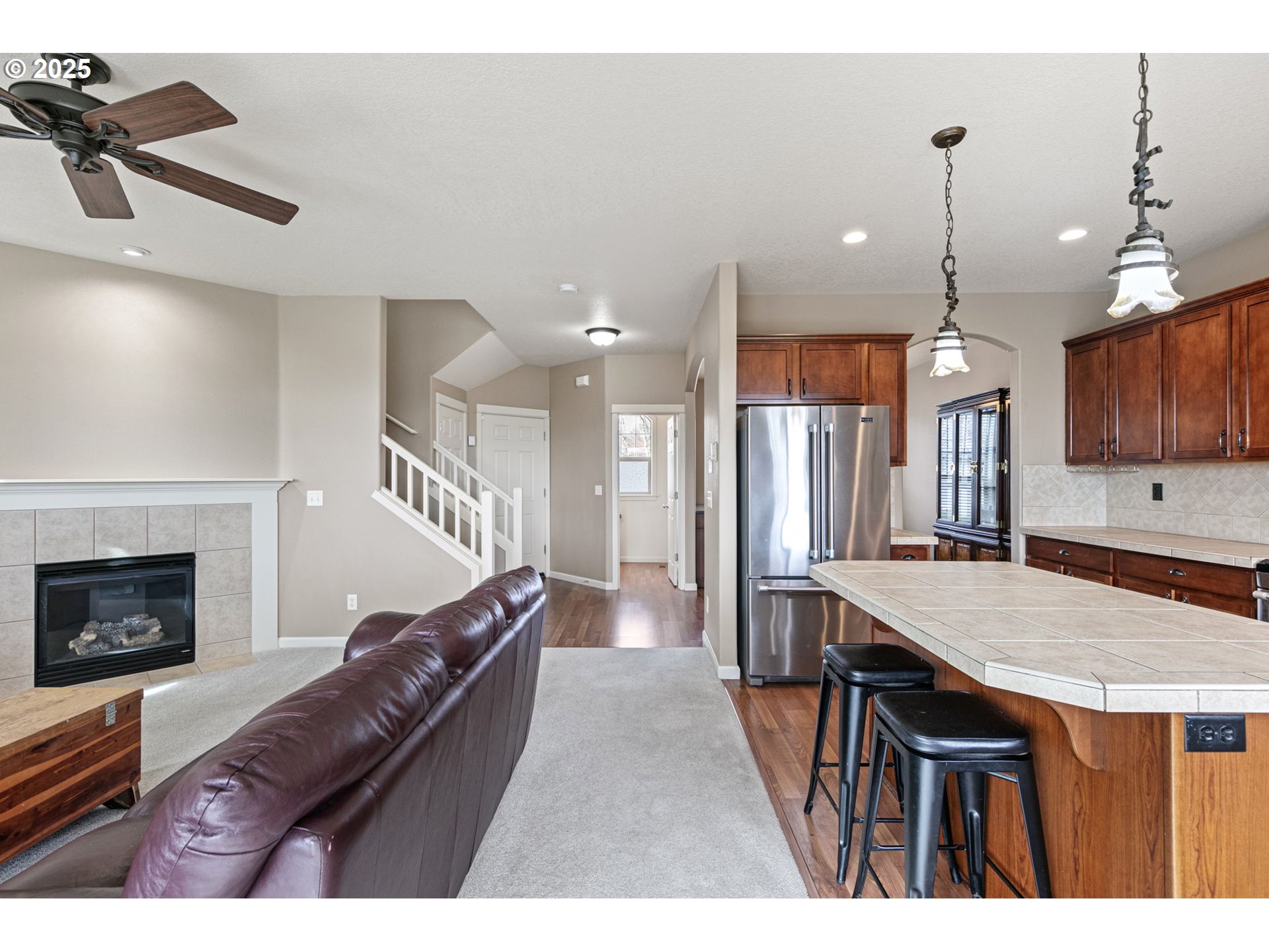 5462 Pranz Place Eugene, OR 97402 - Photo 16 of 43 a living room with furniture a flat screen tv and a fireplace