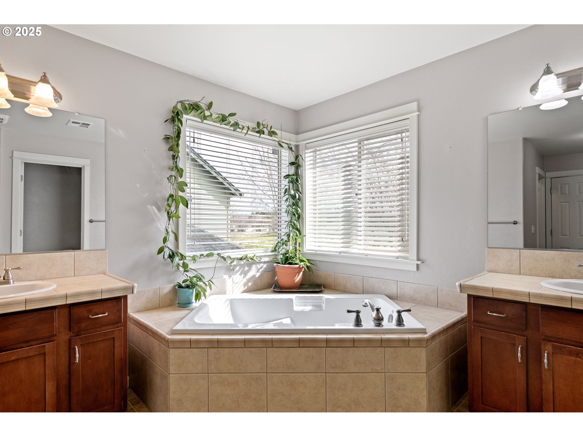 5462 Pranz Place Eugene, OR 97402 - Photo 26 of 43 a bathroom with a sink a large mirror and a window